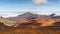 Hawaii - Wide colorful landscape with volcanic craters and cloud shadows