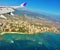 Hawaiian airlines wing of plane above honolulu