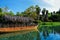 Hawaiian boats, amusement park Port Aventura, river and palms, polynesia