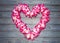 Hawaiian garland of flowers on a blue wooden background.