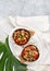 Hawaiian pinapple chicken in natural coconut shell plates on white background