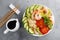 Hawaiian poke bowl with shrimps, rice and vegetables, healthy Buddha bowl with prawns, rice, avocado, cucumber, tomato and lettuce