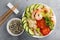 Hawaiian poke bowl with shrimps, rice and vegetables, healthy Buddha bowl with prawns, rice, avocado, cucumber, tomato and lettuce