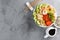 Hawaiian poke bowl with shrimps, rice and vegetables, healthy Buddha bowl with prawns, rice, avocado, cucumber, tomato and lettuce