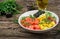 Hawaiian salmon fish poke bowl with rice, avocado, mango, tomato, sesame seeds and seaweeds.