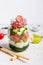 Hawaiian salmon poke salad in glass jar and bamboo chopsticks