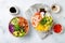 Hawaiian salmon and shrimp poke bowls with seaweed, avocado, mango, pickled ginger, sesame seeds.