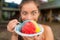 Hawaiian shave ice happy woman tourist making funny face hungry eating sweet frozen snow cone local dessert food of