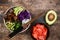 Hawaiian tuna poke bowl with seaweed, avocado, red cabbage slaw, radishes and black sesame seeds.