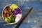 Hawaiian tuna poke bowl with seaweed, avocado, red cabbage slaw, radishes and black sesame seeds.