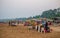 Hawkers selling street snacks and fast food on the Indian beach. Families spend leisure time on beaches