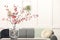 Hawthorn branches with red berries on table in living room, space for text