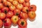 Hawthorn fruits in plate on white background.