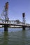 Hawthorne Bridge in fully lowered position on a Late Sunny Summer Afternoon on the Willamette River in Portland Oregon