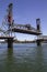 Hawthorne Bridge in nearly fully raised position on a Late Sunny Summer Afternoon on the Willamette River in Portland Oregon