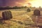 Hay bails at sunset