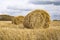 Hay bale. Haystack harvest field. ountryside natural landscape. Agriculture field haystacks in a village or farm with sky. Rural