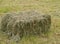 Hay bale in a meadow in spring