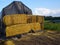 Hay bale stack grain crop in a field