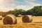 Hay bale and straw in field. English Rural landscape. Wheat yellow golden harvest in summer. Countryside natural landscape