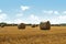 Hay bale and straw in the field. English Rural   landscape.   Wheat yellow golden harvest in summer. Countryside natural landscape