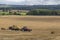 Hay Baler working in a field - United Kingdom