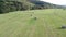 Hay bales from above on a large agricultural meadow filmed in 4k