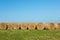 Hay Bales in Afternoon Sunshine against Horizon