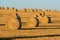 Hay bales on the field after harvest. Agricultural field.