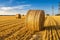 Hay bales on the golden agriculture field