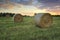 Hay bales in the Hawkesbury fields with a pretty sunrise sky behind