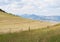 Hay Bales on the Hillside with Fence