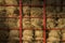 Hay bales piled within a cart lit diagonally