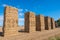 Hay bales stacked high in a line