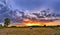 Hay bales at sunset. Sun rays filling up the sky