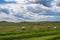 Hay bales under dramatic sky