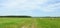 Hay balls, field and cloudy sky, Lithuania