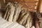 Hay sheaves in old wooden barn interior