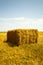 Hay stack on the agriculture field - vertical view