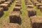 Hay stack cubes in field. Concept of eco seats for people during festival. Summer concept. Berry Festival Brusviana.