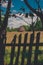 Hay stack framed with a old wooden fence and trees