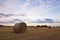 A haybale after the harvest at dusk time