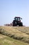 Haymaking: tractor turning hay.