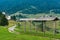 Hayrack on hilltop and Sorica village in Slovenia