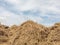 Haystack in field that is stacked together into a large pile