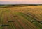 Haystack on field on sunset background. Hay bale from residues grass.