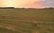 Haystack on field on sunset background. Hay bale from residues grass. Hay stack in agriculture.