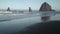 Haystack rock and surf Cannon Beach 4K UHD
