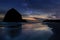 Haystack Rock under Starry Night Sky along Oregon coast