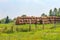 Haystacks on an agricultural field under a blue sky. The autumn harvest on the farm is already ready